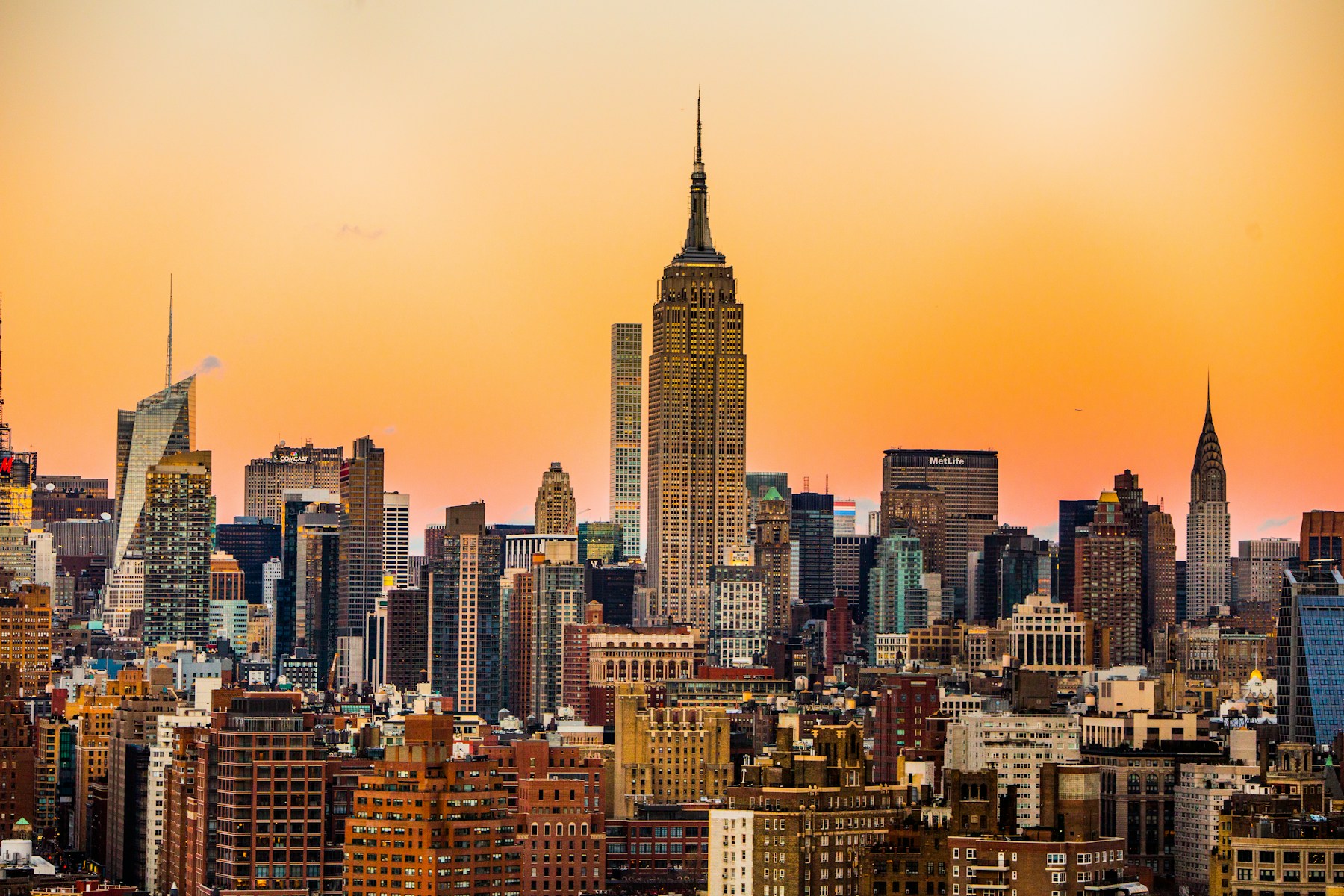 The Empire State Building above Manhattan in warm evening light